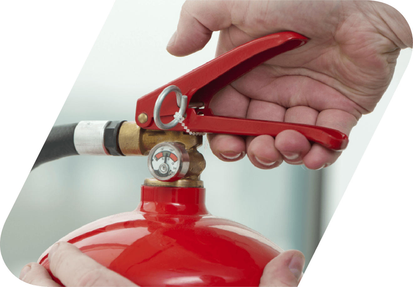 A man checking a fire extinguisher.